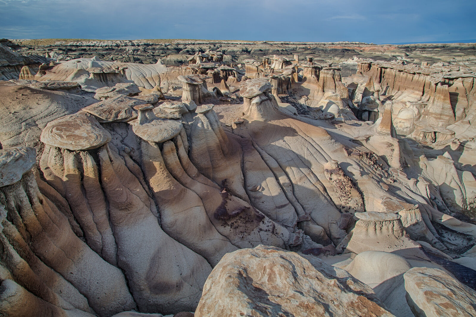 Eroded badlands and hoodoo formations in the Bisti/De-Na-Zin Wilderness of New Mexico.